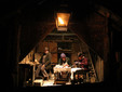 TAGLIALEGNA/WOODCUTTERS-LUMBERJACKS: Daniele Somà, Emanuele Basso and Gabriele Dho play the woodcutters-luberjacks.  Behind them, more logs sent by woodcutters working on the hill above come down through a wire fixed to a big wooden stake. Woodcutters above can be heard shouting from time to time “Alla vita!” (Be careful!), to which workers at the foot of the hill respond “Campa!” (Throw it down!), communicating that there is no danger and that everybody will keep safe and away from the descending logs. (Gianluca Avagnina Photography)