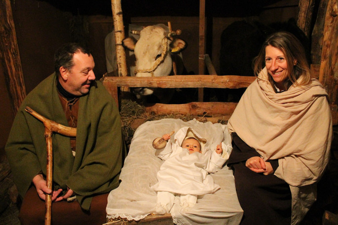 (continued) ...The Holy Family is always played by a local family: this year it was impersonated by Massimo Maule (Saint Joseph), Manuela Marenchino (Virgin Mary) and the little Greta Maule (Baby Jesus). The manger is traditionally located in a hut opposite to the main entrance to the Parochial Church. (Gianluca Avagnina Photography)